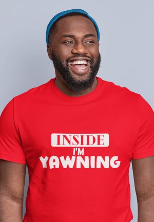 Man wearing t-shirt with text reading "inside i'm yawning"